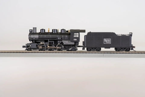 Side view of Two Six Two Steam Locomotive With Smoke Unit And Tender For HO Scale Boston And Maine Railroad Model on track