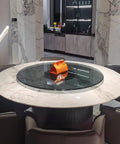 Heavy-Duty Round Glass Lazy Susan For Dining Table 360 Degree Rotating Turntable Serving Tray Transparent Tempered Glass 47 Inch Grey Ideal For Home And Hotel Tables on a dining table with an orange item on top.