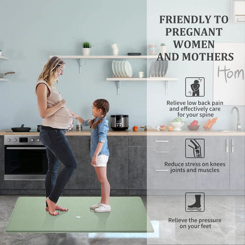 Woman and child on light green Comfy Anti Fatigue Kitchen Mat 17x59, non slip memory foam, for standing long hours in kitchen.