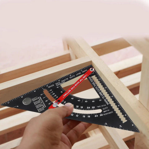 Hand using Pro Grade Adjustable Aluminum Triangle Ruler With Imperial Scale 7-Inch Woodworking And Carpentry Square on wood frame