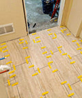 DIY Tile Leveling System Clips 4000 Pack For Ceramic Tile And Stone Easy Install Leveler Spacers For Wall Or Floor One Thirty Second Inch Grout Joint Fits One Eighth To One Half Inch Tile Thickness in use on floor for even tile spacing.