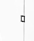 Contemporary 6 Inch Back To Back Shower Door Pull With Grooved Accent In Matte Black Finish Crafted From Solid Brass For A Slick Durable Modern Bath Accessory And Easy Reversible Mount visible on glass door.