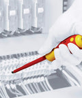 Hand using Insulated SlimLine Interchangeable Pro-Grade Screwdriver Set With Handle, 1000 Volt Rated in tight electrical panel space.