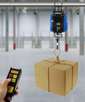 Huge 1100 Lb Electric Winch With Wireless Remote And 98 Foot Cable, Powerful 1800W Motor lifting a box with remote control.