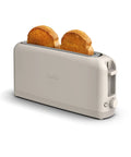 Slick Two Slice Slim Toaster With Hella Long Slots For Versatile Even Heating And A Tight Oat Milk Finish That Ditches Everyday Countertop Clutter While Kicking Out Perfect Crisps Daily showing toasted bread.