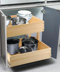Premium Two Tier Pull Out Cabinet Organizer Featuring Ball Bearings And Smooth Glide Slide Out Drawer For No Sweat Assembly Tons Of Room Under Counter Kitchen Pantry Storage Solution Fits 17 Wide with pots and bowls.