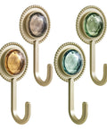 Slick Four Pack Adhesive Wall Hooks For Hanging Towels And Robes With Knockout Grip No Drilling Required Super Quick Mount For Bathroom Kitchen Or Entryway Storage, featuring decorative gems.