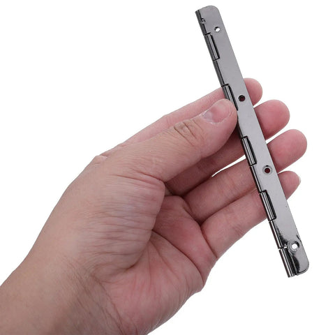 Hand holding a 5 inch black piano hinge from the 2 Piece Heavy Duty Stainless Steel Piano Hinge 5 Inch Black Tough As Nails cabinet hardware.