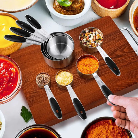 16 Piece Measuring Cups And Magnetic Spoons Set In Stainless Steel With 8 Nesting Cups And 7 Double Sided Magnetic Spoons on countertop.