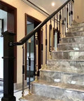 Built Tough Adjustable Stair Railing Spindles And Deck Balusters Made From Wrought Iron With Rust Proof Coating Great For Interior Steps Exterior Landings Featuring Flexible Mounting Brackets And Crisp Black Gold Modern Columns 10 Pack installed in an elegant stairway.