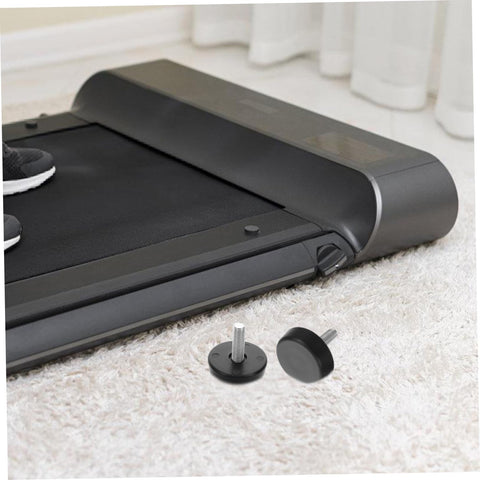Four Piece Adjustable Treadmill Levelers With Non Slip Swivel Base And Universal Mounting Bolts against a treadmill on carpet.