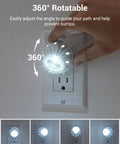 Close-up of Plug In Night Light with Dusk To Dawn Sensor 360 Degree Rotating Head, glowing in dark room, hand adjusting angle