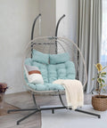 Two Person Egg Swing Chair With Stand For Indoor And Outdoor Patio Wicker Rattan Hanging Chair with cushion, light blue, in living room.