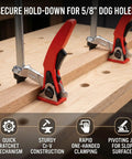 Two Pack Welding Table Clamps For Three Quarter Inch Dog Holes Heavy Duty Workbench Clamps with red grips on wooden bench