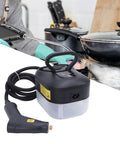 All Purpose Portable High Temperature Steam Cleaner For Home And Auto Cleaning with a hose attached, used on a stovetop