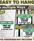 Durable Aluminum First Aid Station Sign 8 By 12 Inches displaying 'Safety First' hung with rope, screws, tape