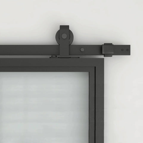 Close-up of 30 Inch By 84 Inch Frosted Glass Barn Door With Black Steel Frame And Three Quarter Lite Panels Ships Fully Preassembled