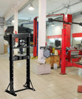 Shop Ready Badass 12 Ton Hydraulic Shop Press With Adjustable H Frame Safety Valve And Stamping Plates in a garage setting.