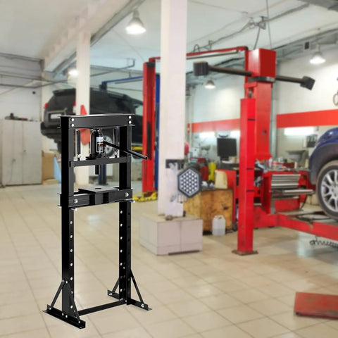 Shop Ready Badass 12 Ton Hydraulic Shop Press With Adjustable H Frame Safety Valve And Stamping Plates in a garage setting.