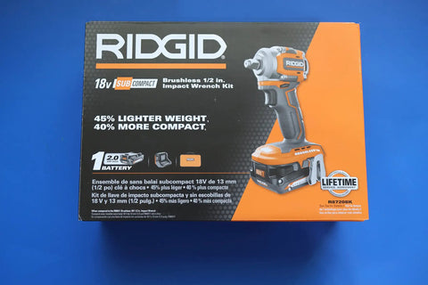 18V Subcompact Brushless Cordless Half Inch Impact Wrench Kit With 2Ah Battery For Tight Spaces And Heavy Duty Automotive Work Compact Design Beast Torque Durable Construction All Day Power box on blue background