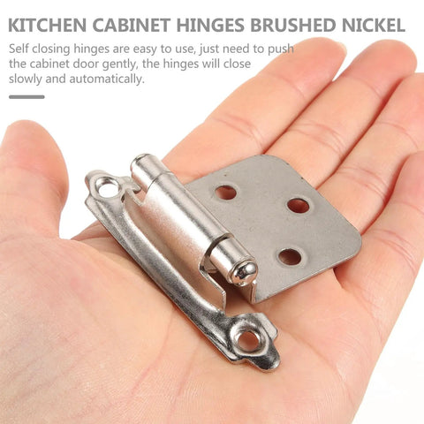 16 Piece Kitchen Cabinet Door Hinges Brushed Nickel Spring Loaded Self Closing Soft Close Dampers shown in hand for size.