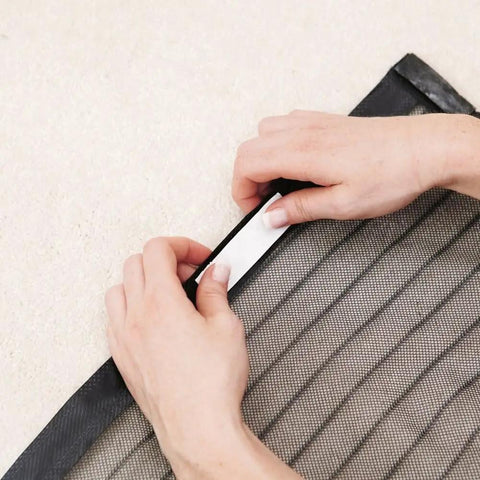 Hands installing Hands Free Magnetic Door Screen For Double Doors Keeps Bugs Out And Fresh Air In Easy Install Mosquito Net