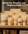 100 Pcs Kraft Stand Up Pouches With Matte Window Resealable Zipper Bags displayed with snacks like pretzels and nuts
