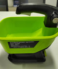 Cordless All Season Spreader for 18V Lithium Batteries on table, green container with black handle, year round yard care