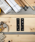 Hidden Wood Door Pivot Hinge Stainless Steel Full Rotation Heavy Duty Invisible Door Hardware Matte Black Finish on wooden surface with tools