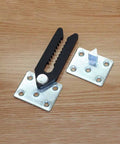 Heavy Duty Sofa Connector Clip For Sectional Couches Rust Proof Metal Buckle Furniture Joint Clip in silver and black on wood.