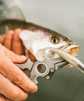 Titanium Fishing Pliers With Side Cutters, Halo Hinge, Lanyard, Leather Sheath, used for dehooking fish in saltwater.