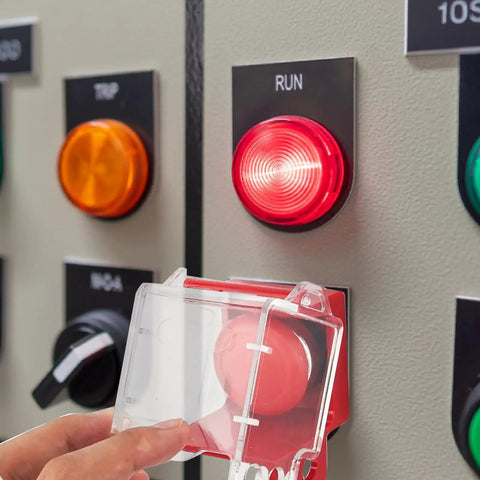 Person opening Emergency Stop Button Cover Box Type Transparent Push Button Switch Shield Heavy Duty Boss Level Protective Housing For 22mm To 33mm Button Diameters Clear Case Made From Glass Resin PC Industrial Grade on control panel.