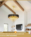 Five Light LED Teardrop Crystal Pendant Chandelier In Gold Finish For Kitchen Island Foyer Hallway And Bedroom Modern Raindrop Ceiling Light With 4000K Neutral White Glow Lit, hanging in a modern living room with exposed beams.
