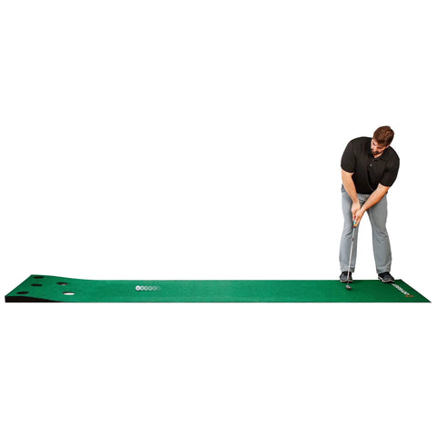 Man practicing golf on Odyssey 10 Foot Indoor Putting Green Mat For Home Or Office Practice With Realistic Surface And Extended Length Built For Confidence And Distance Control So You Can Nail Consistent Putts Like A Boss