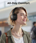 Person wearing Hybrid Active Noise Canceling Headphones With Custom EQ Via App Multiple Modes Hi Res Audio And 50 Hour Battery Life Bluetooth Multipoint Connection Comfortable Fit For Travel And Everyday Use