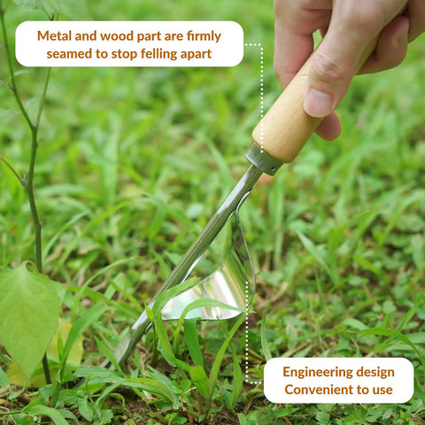Close-up of stainless steel hand weeder with wood handle from Heavy Duty Garden Tools Set With Basket, used for gardening in grass.