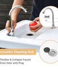 Person using Portable Outdoor Fish Cleaning Table With Sink And Sprayer, featuring 360 degree faucet and drain hose.