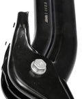 Rear driver-side suspension trailing arm, black steel, side view with mounting bolt.