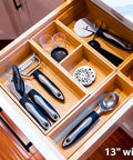 2.5 Inch High Bamboo Drawer Organizer With Five Rearrangeable Bins For Kitchen, Office, Makeup, Jewelry And Closet, Durable Bamboo Construction For Neat Drawers And Easy Access shown in a kitchen drawer.