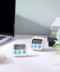 Bulk 12 Pack Digital Kitchen Timers With Magnetic Mounts, Count Up And Countdown Timers, Large Digits, Loud Alarm, Desk Stopwatch on table