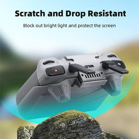 RC Sun Hood Shield For DJI RC 2 Controller showing underside view with joystick guards in outdoor setting