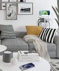 Living room with mounted 2 Pack Surge Protector Power Strip With 4 USB Ports, charging devices next to a gray couch with pillows