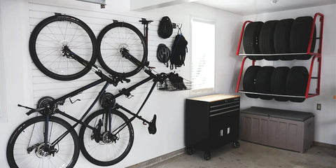 Bicycles hung on SlatWall 12 Inch White Sample for Quick Color Check and storage in a garage setting with organized tools.