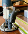 Guide Rail Adapter Fits Bosch 1617 Router Converts Plunge Or Fixed Base To Track Saw System For Dead On Cut Accuracy Uses Original Sub Base Screws For A No Sweat Install Designed And Built In America mounted on a wooden table.