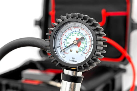 Close-up of pressure gauge showing air pressure for Tough As Nails Portable 12V Dual Cylinder Air Compressor Pump 150 Psi And 6 16 Cfm Fast Tire Inflator.