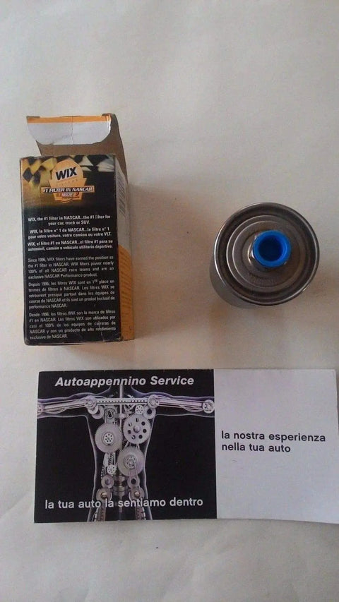 Premium Fuel Filter For Clean Fuel System next to packaging and service card on a white background.