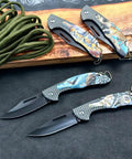 Four Pack Folding Pocket Knives With Wild Animal Print Handles For Everyday Carry EDC Gear displayed on a wooden board.