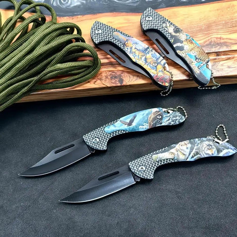 Four Pack Folding Pocket Knives With Wild Animal Print Handles For Everyday Carry EDC Gear displayed on a wooden board.
