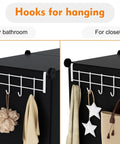 Hooks for hanging displayed on a stackable cube storage organizer, ideal for bathroom or closet use.