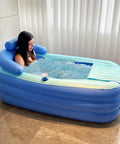 Inflatable Bathtub For Adults Freestanding Portable Foldable Spa Tub With Air Pump Perfect For Hot Soak Or Ice Bath At Home Spacious 63 By 33 By 25 Inches Cup Holder And Zip Up Cover in use